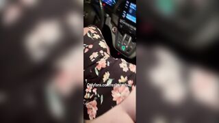 wife in car seat while husband films