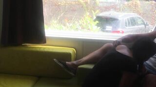 Wife giving risky blowjob in front of window in a camper van