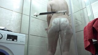 Slim MILF with a big booty in the shower.