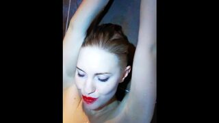 Russian bitch plays with her wet pussy in the shower