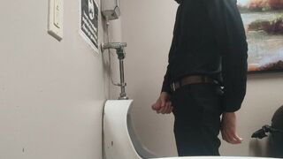 Pissing at public urinal and jerk off before someone comes in