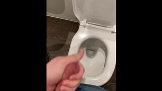 Wanking off in public cubicle with big cumshot at the end