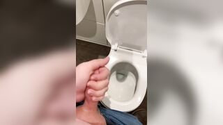 Wanking off in public cubicle with big cumshot at the end