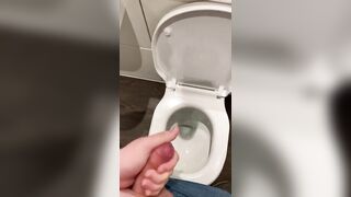 Wanking off in public cubicle with big cumshot at the end