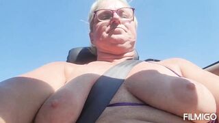 Tits out while riding in a convertible