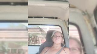 Blonde milf riding around with her tits out