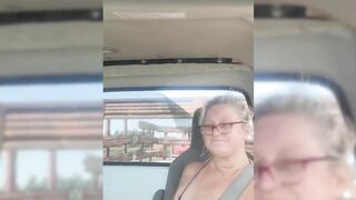 Blonde milf riding around with her tits out