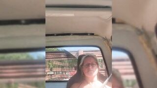 Blonde milf riding around with her tits out