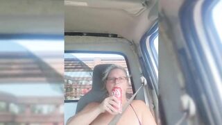 Blonde milf riding around with her tits out