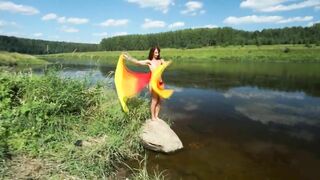 Dance with Colors Fans on boulder in river