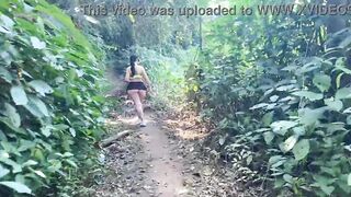 Big ass in a mini skirt walking in the woods