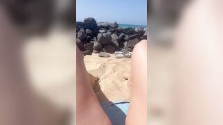 Girl without pants on public beach showing pussy