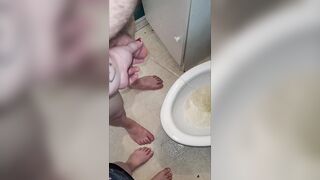 Teacher and student morning pee. Teacher helps student