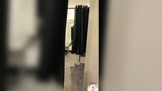 Whore gets fucked with a dildo in a public changing room