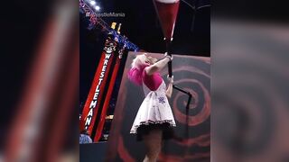 WWE - Alexa Bliss turning a crank at Wrestlemania 37