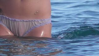 Beach girl goes for swimming in panties - watch out